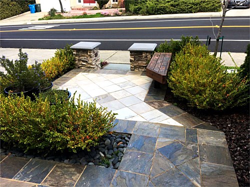Entrance Every design detail is used here fully. The bench mimics the angle provided by the tile floor. Lighting is present at the step beside the sidewalk.
