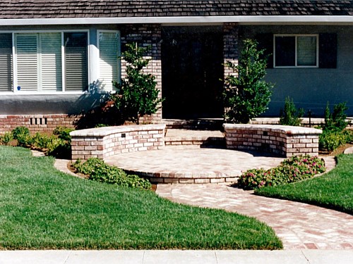Entrance Using the same style and color brick found on the residence makes this new entrance appear custom. The Client requested a design that would make their home look like one in Palo Alto. I believe this was achieved!