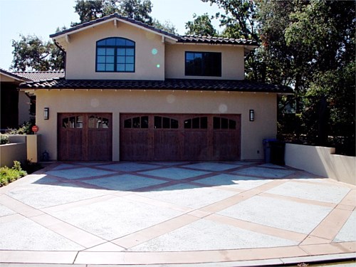 Garage Concrete The double wide driveway provides more opportunity for design accent.