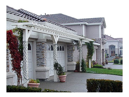 Garage Arbor The arbor provides interest to this home not present in any neighbors front yard.